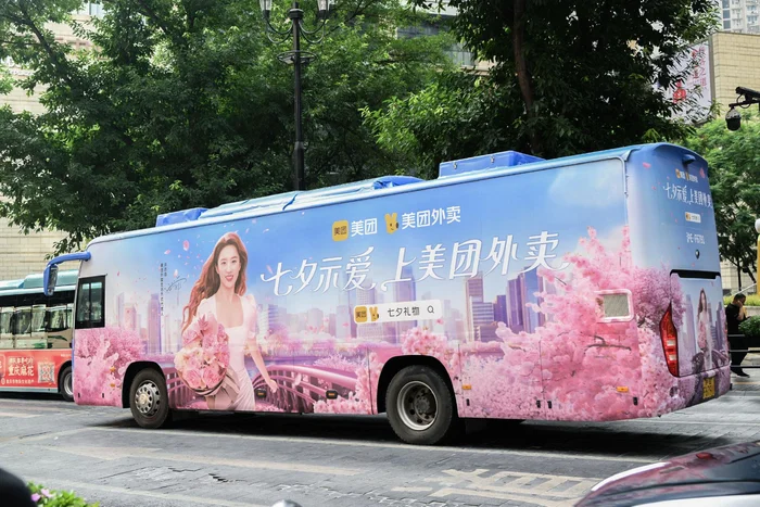 Meituan Qixi Festival campaign bus advertising instant delivery services highlighting spontaneous gifting and on demand romance during the holiday period