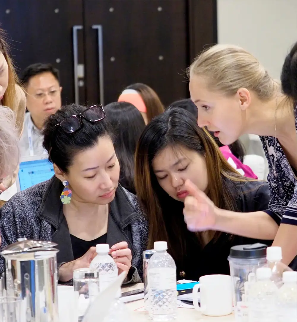 Ashley Dudarenok advising participants during hands on a workshop