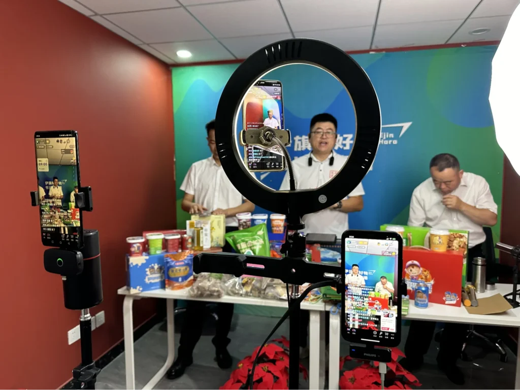 WeChat livestream setup with smartphones and ring light