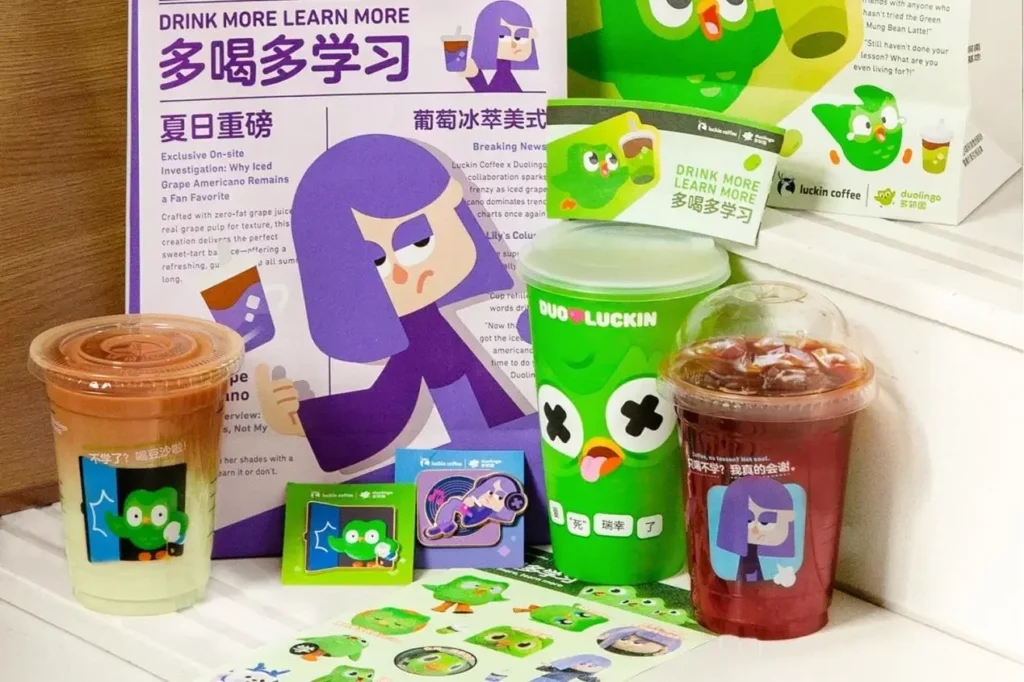 Luckin Coffee and Duolingo collaboration campaign merchandise and drinks promoting the Green Shasha Latte during the viral 2025 Chinese social media marketing campaign.