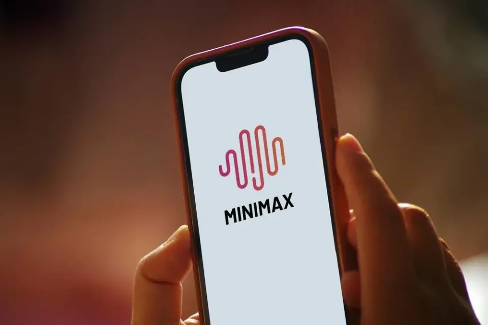 Smartphone displaying MiniMax AI logo representing mobile access to AI tools and applications