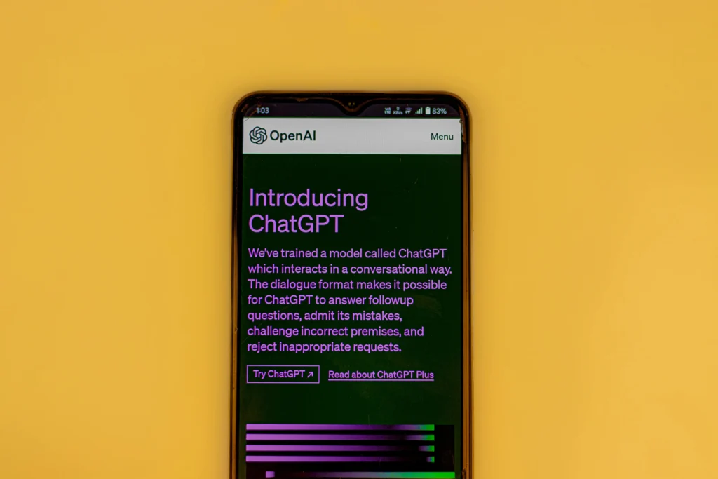 Smartphone displaying OpenAI ChatGPT introduction page with features and description