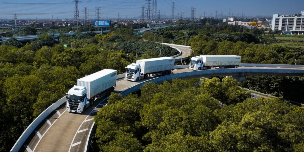 Pony AI autonomous trucks driving in convoy on highway showcasing PonyTruck logistics and freight automation