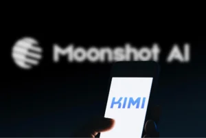 Smartphone displaying Kimi AI app with Moonshot AI branding blurred in the background