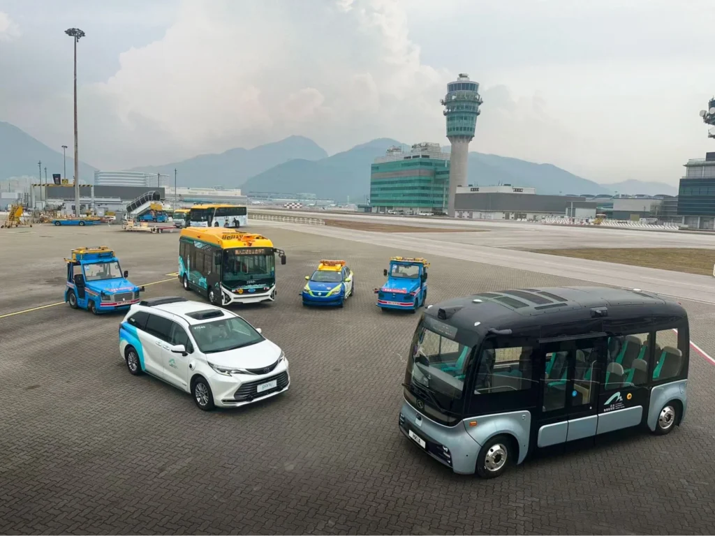 Pony AI autonomous vehicle fleet including robotaxis, buses, and service vehicles at airport mobility hub