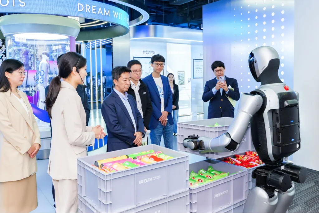 UBTECH robot demonstrating retail and service interaction with people in real-world commercial environment