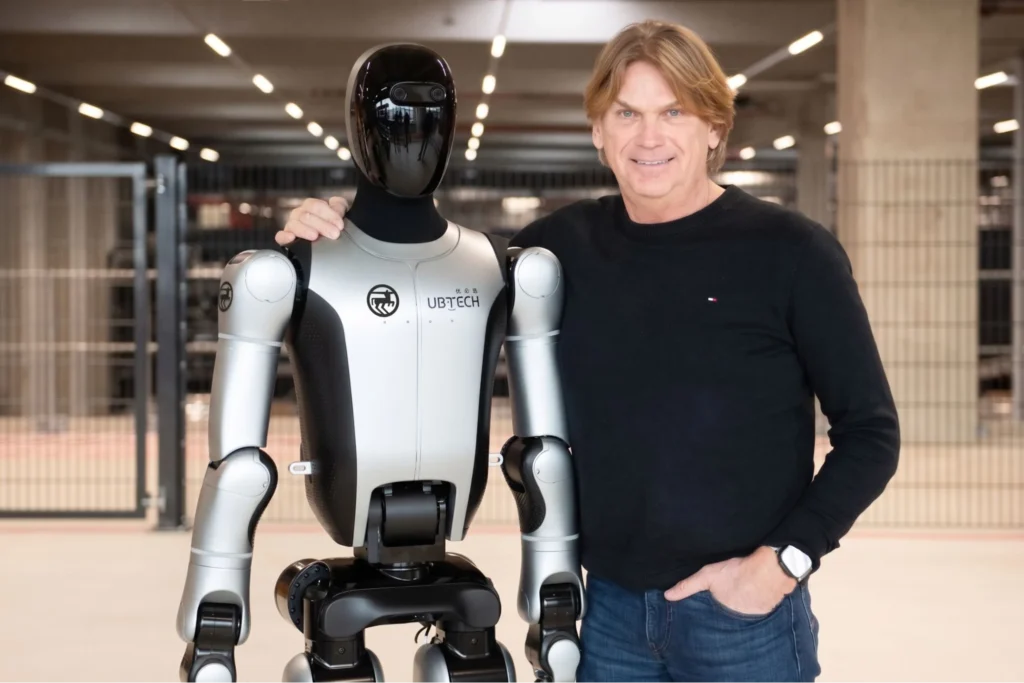 UBTECH humanoid robot alongside human showcasing human-robot interaction and industrial AI design