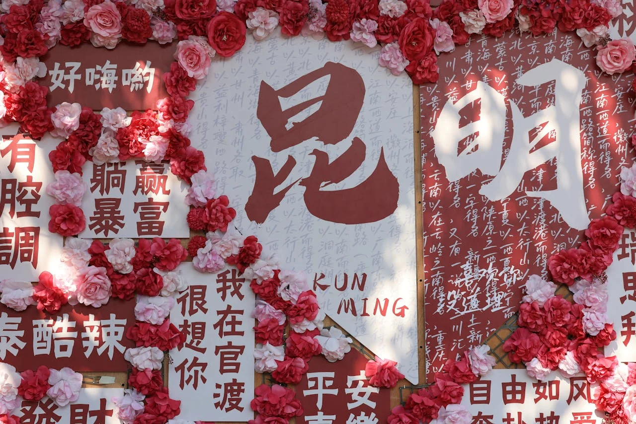 Qixi Festival themed wall decorated with red flowers and Chinese characters expressing love and emotions during Chinese Valentine’s Day celebrations