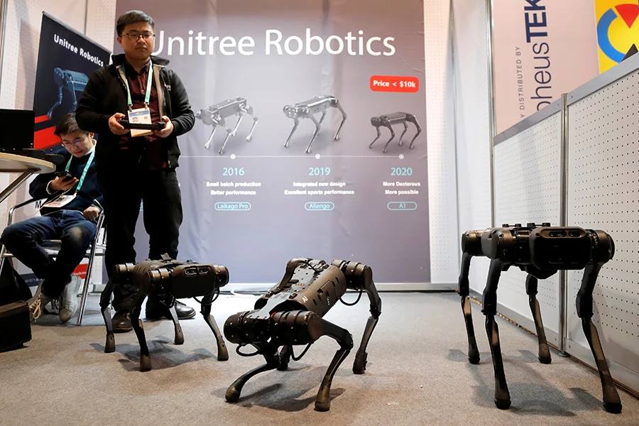 Unitree quadruped robots showcased with development timeline at robotics event