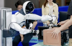 AgiBot humanoid robot demonstrating real-world object handling.