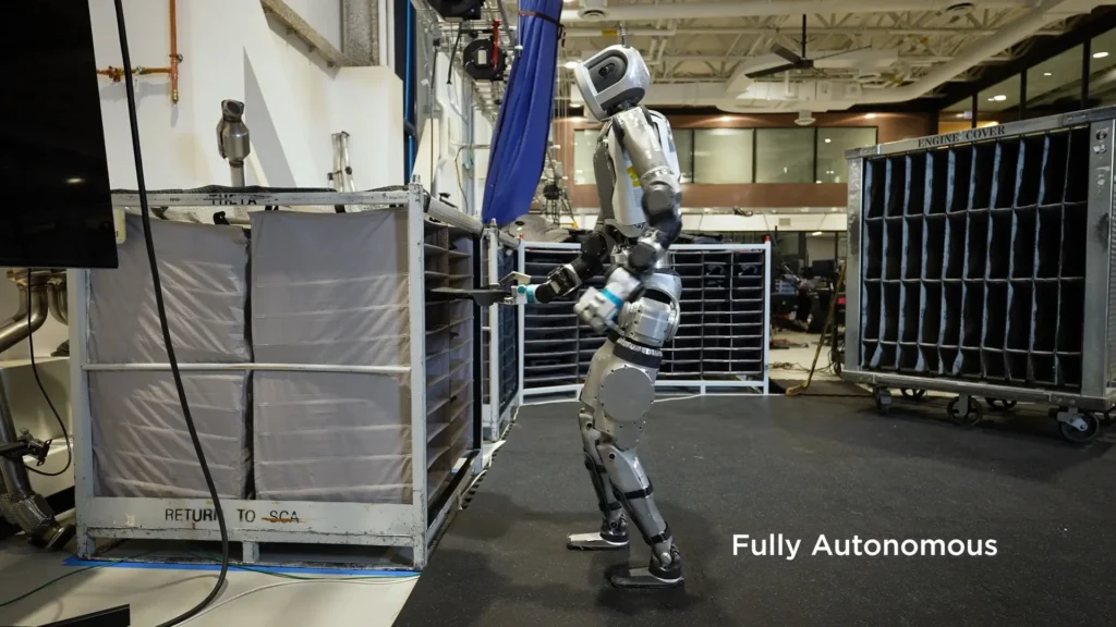 Humanoid robot testing autonomous movement in an industrial setting.