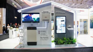 BYD residential battery energy storage booth featuring Power-Box systems and the BYD Energy App interface.