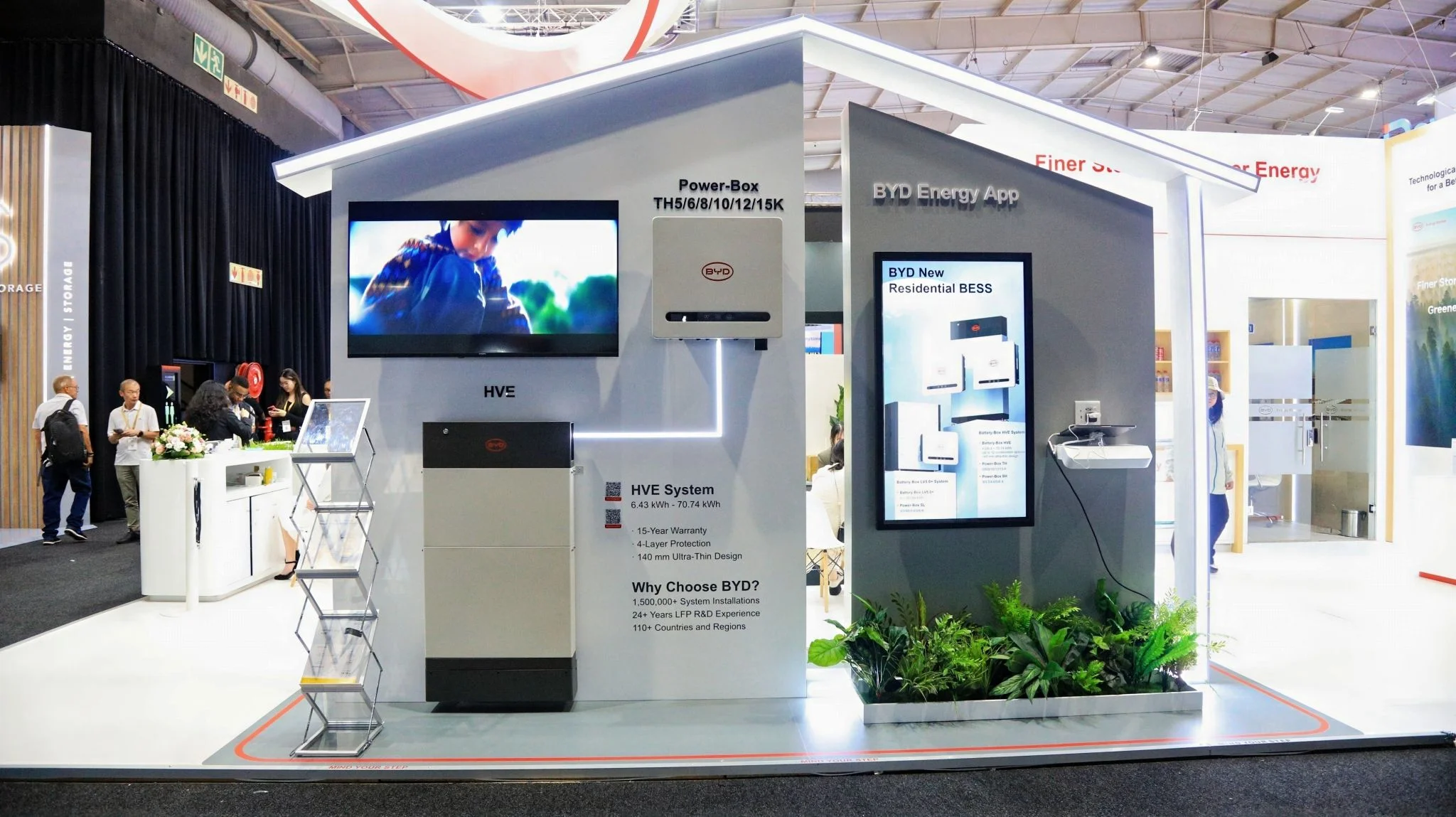 BYD residential battery energy storage booth featuring Power-Box systems and the BYD Energy App interface.