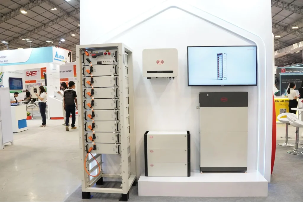 BYD residential energy storage systems and battery units showcased at a clean energy exhibition booth.