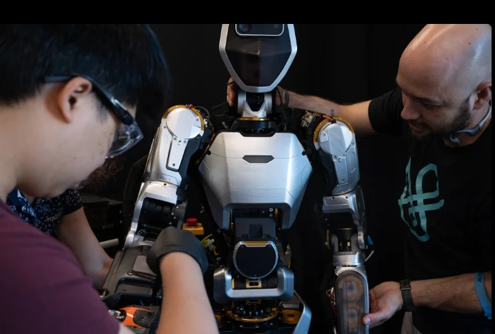 Sanctuary AI engineers assembling and testing the Phoenix humanoid robot.