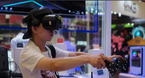 User experiencing virtual reality gaming with headset and motion controllers