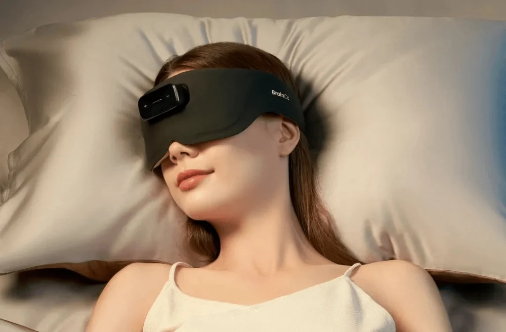 Woman wearing BrainCo EEG headband device for sleep monitoring and brain signal tracking