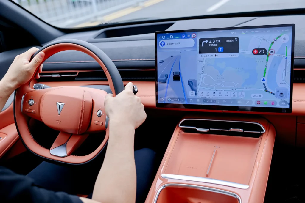 Huawei smart car cockpit with large touchscreen navigation and AI driving interface