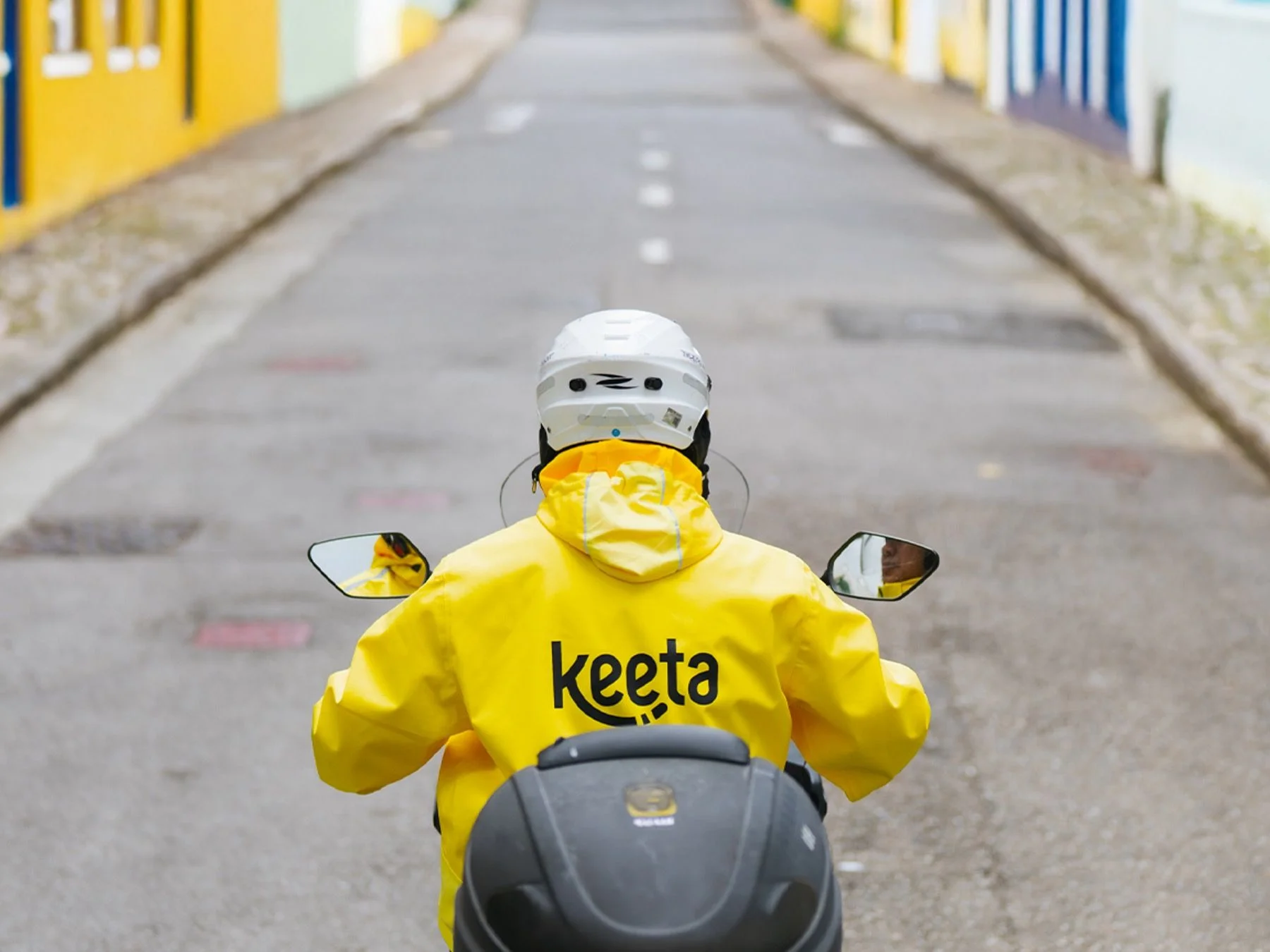 Keeta food delivery rider on scooter showing Meituan’s last-mile delivery network in urban environment
