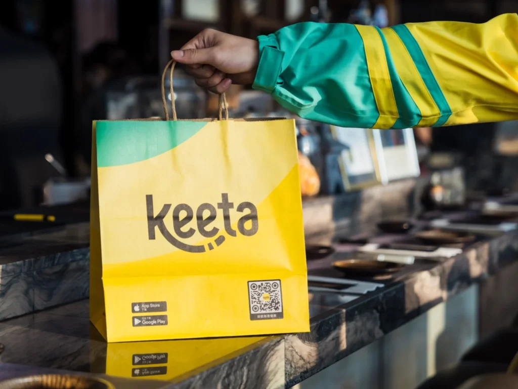 Keeta delivery order handoff showing food delivery service and local commerce transaction