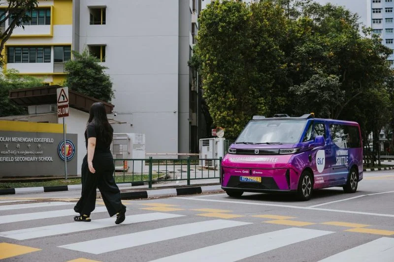 WeRide autonomous vehicle stopping at pedestrian crossing in urban environment