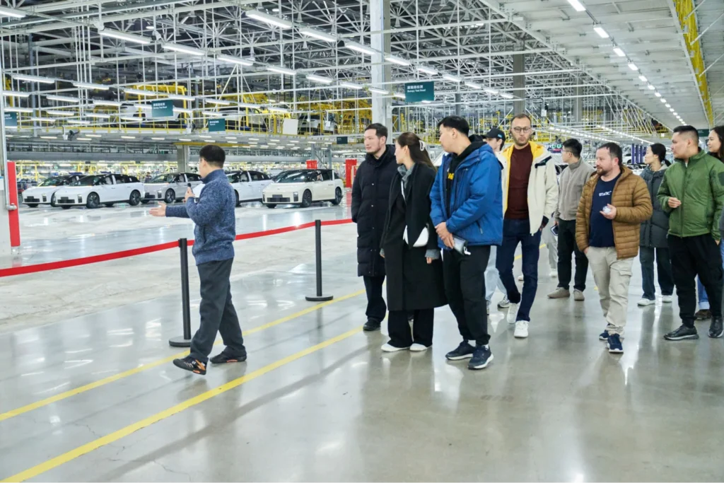 Visitors touring Li Auto vehicle production facility