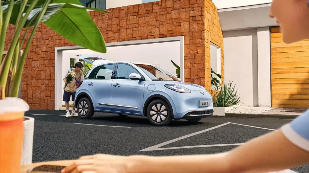 Wuling Bingo compact electric car parked outside a modern home