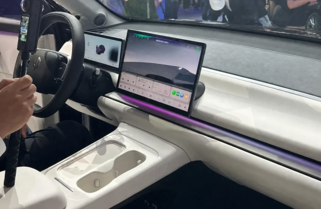 Interior of a BYD vehicle featuring a large infotainment screen and smart cockpit controls.