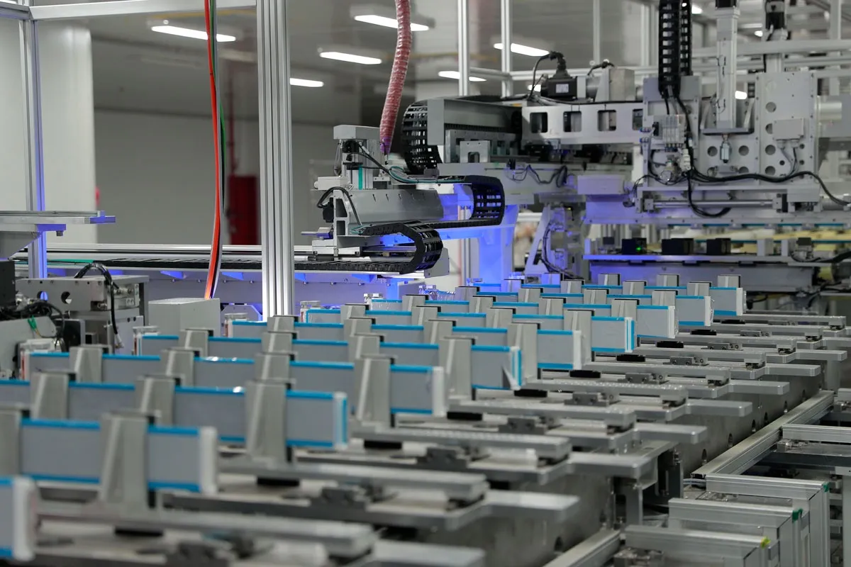 Automated battery cell production line inside a clean factory.