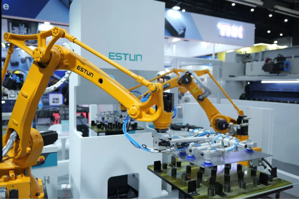 ESTUN robotic arm performing automated material handling at a trade show