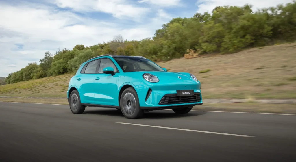 Turquoise GWM ORA 5 electric SUV on road