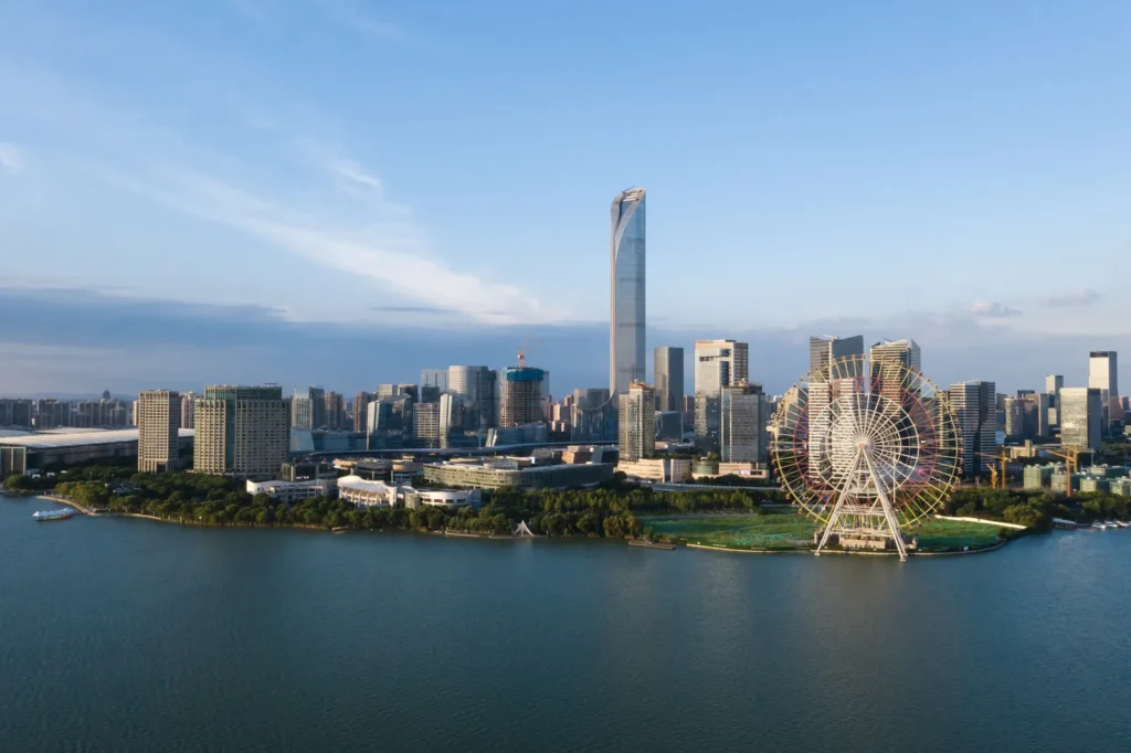 Suzhou skyline with lake and Ferris wheel
