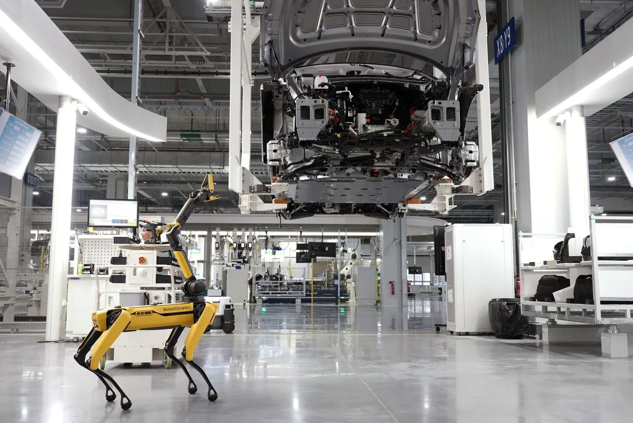 Quadruped robot inspecting a modern automotive production line
