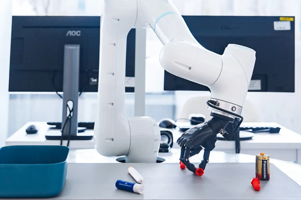 Robotic arm sorting parts on a workstation