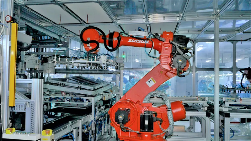 Orange SIASUN robotic arm working in automated factory production line.
