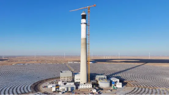 Tall solar tower surrounded by mirror fields in China