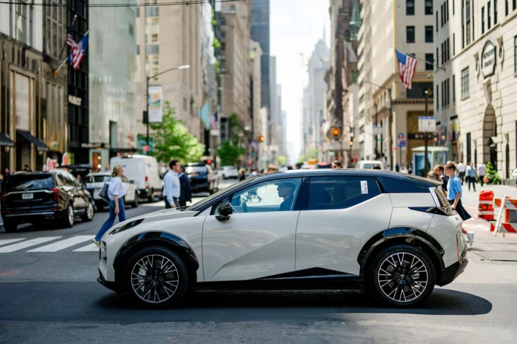 White Zeekr electric SUV on a city street, showing Geely’s global EV expansion beyond China