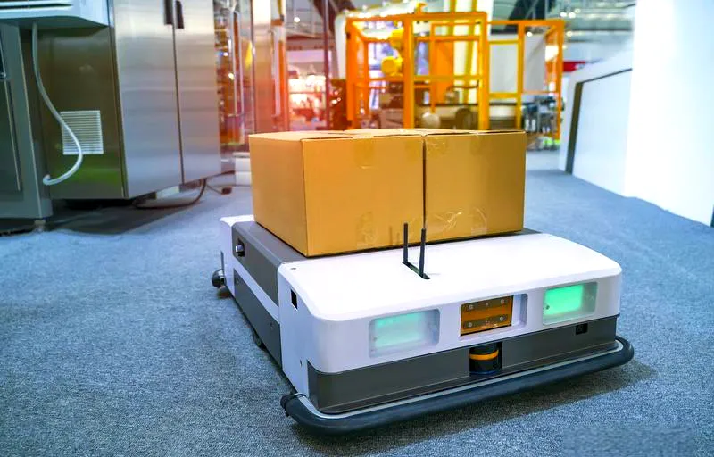 AGV carrying boxes in an automated facility