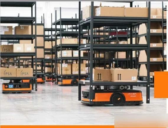 AGV robots moving boxes under warehouse shelves