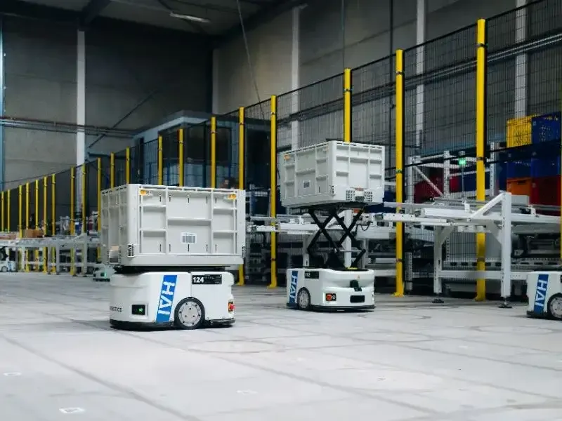 Tote-carrying robots operating in an automated warehouse