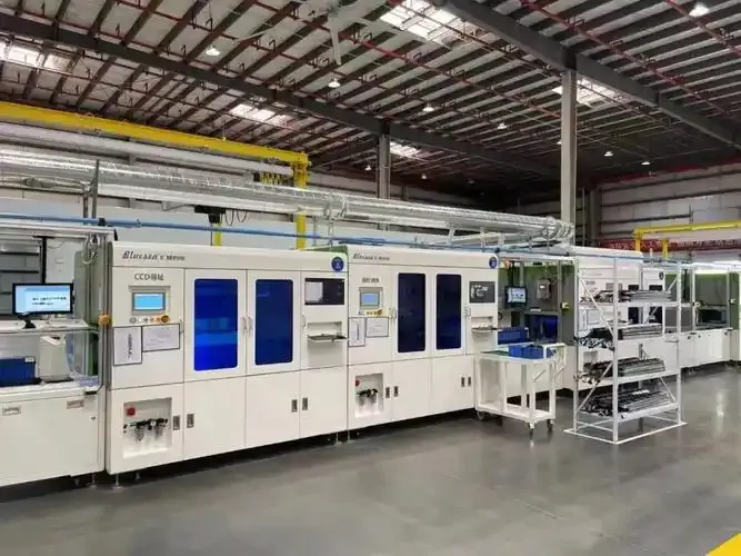 Automated battery processing equipment in a factory