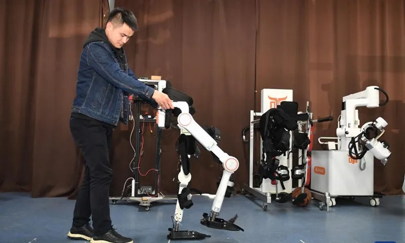 Man testing lower-limb rehabilitation exoskeleton