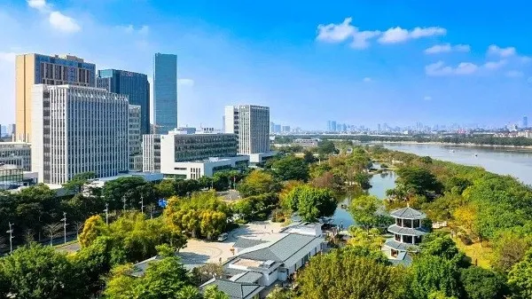 Guangzhou China riverside skyline with green park and modern buildings