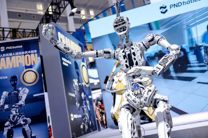 Humanoid robot showcased at a robotics exhibition booth.