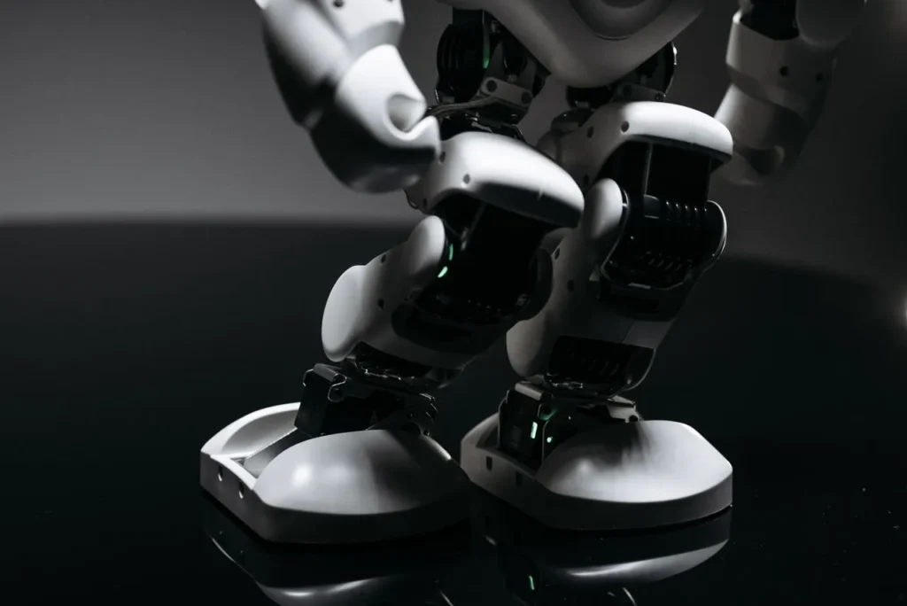 Close-up of humanoid robot legs and joint components.