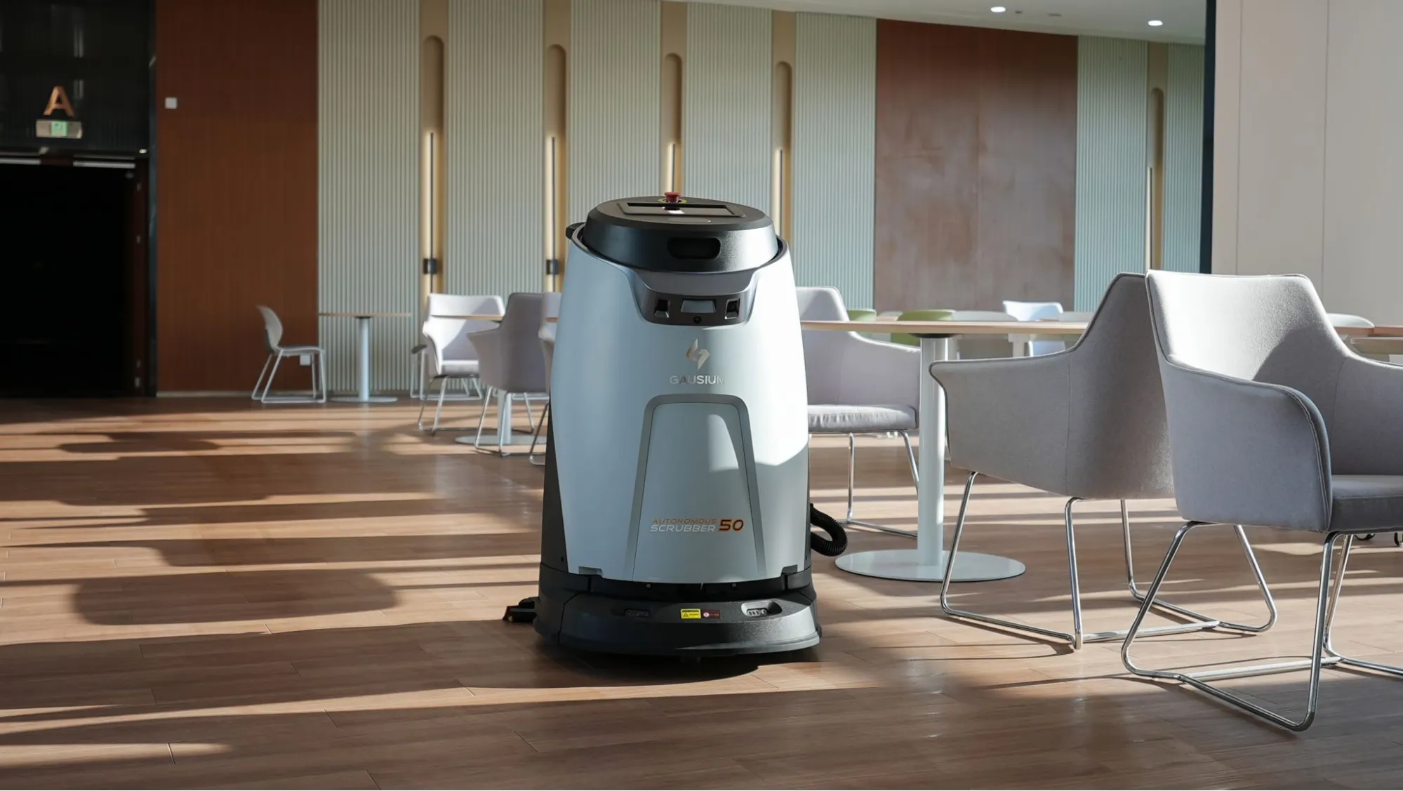 Gausium scrubber in lounge area