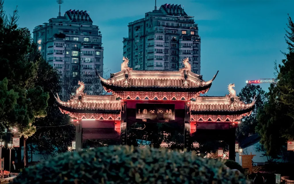 Traditional Chinese gate lit at night