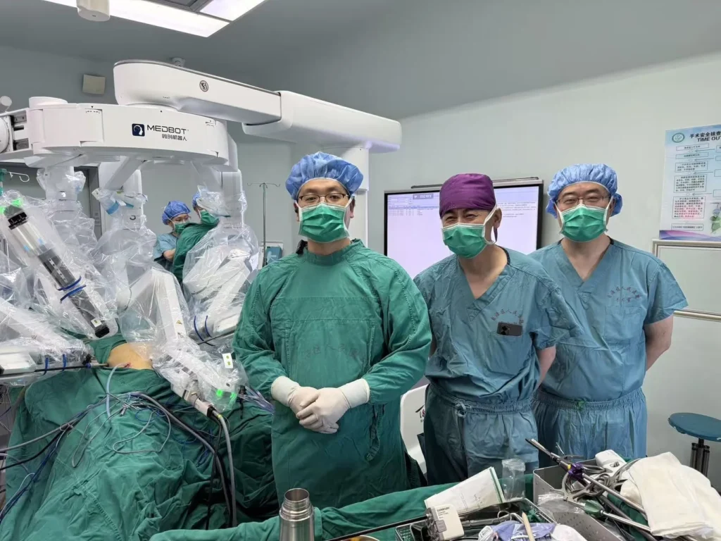 Surgeons standing beside medical robotic system