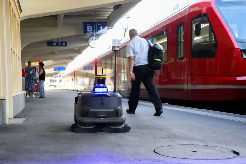Floor cleaning robot on train platform