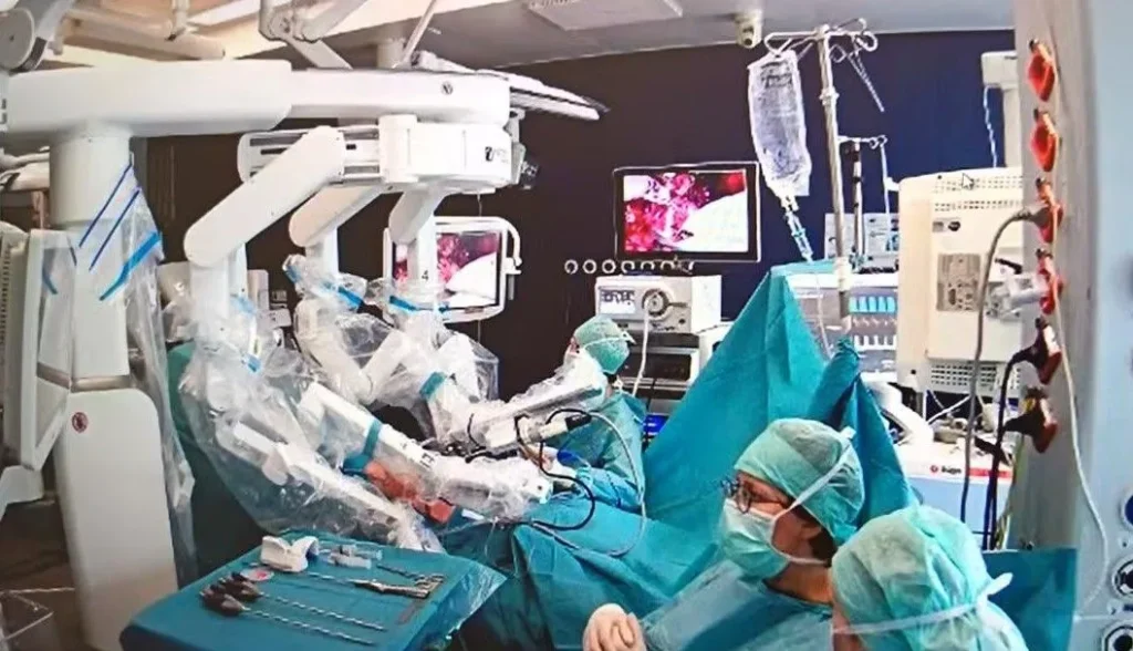 Robotic arms assisting surgery in operating room